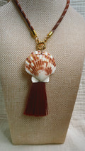Terracotta striped scallop shell with burgundy silk tassel