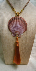 Mauve scallop shell necklace with copper silk tassel on patterned cord