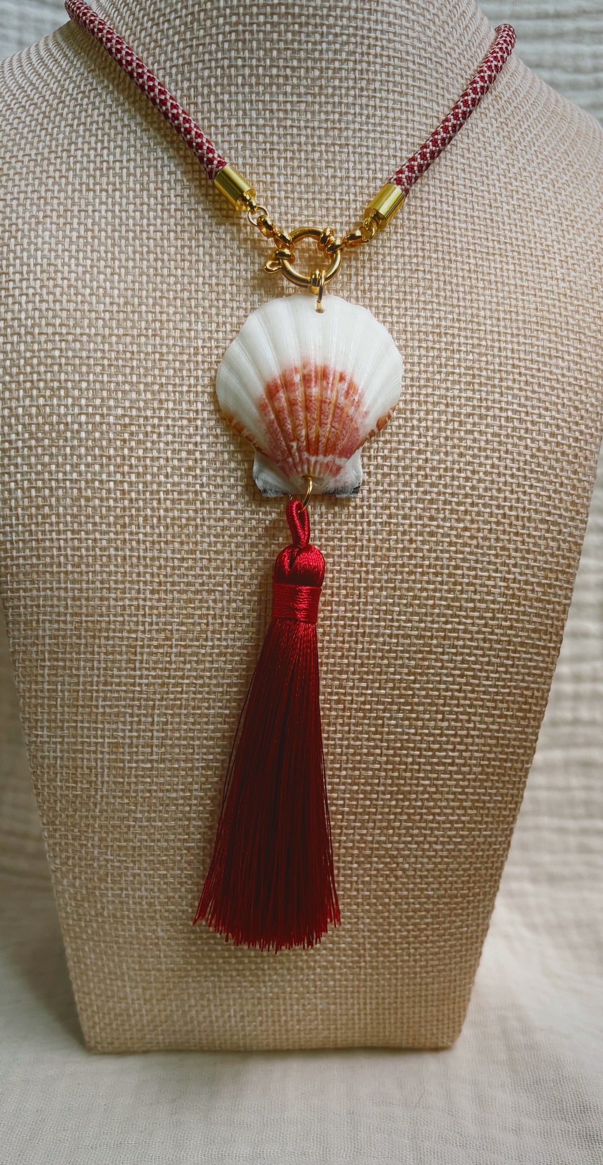 Scallop shell necklace with burgundy silk tassel on patterned cord
