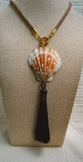 Orange and white scallop shell with black silk tassel