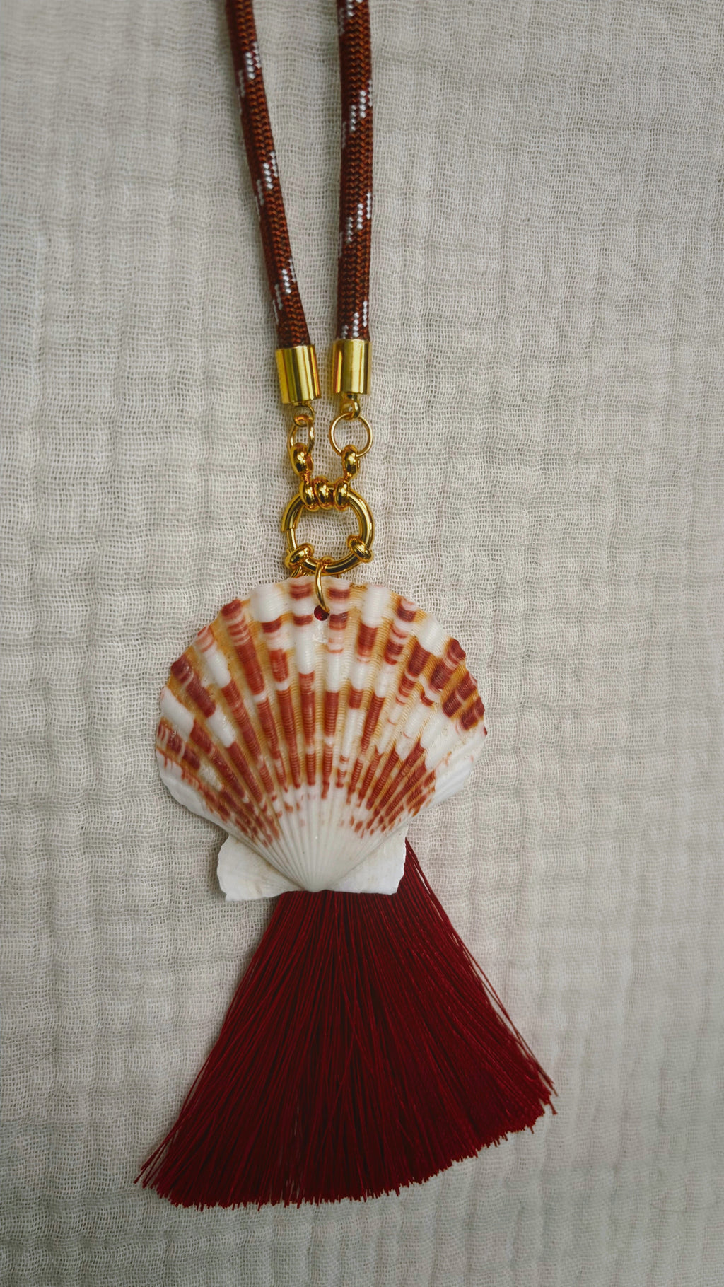 Terracotta striped scallop shell with burgundy silk tassel