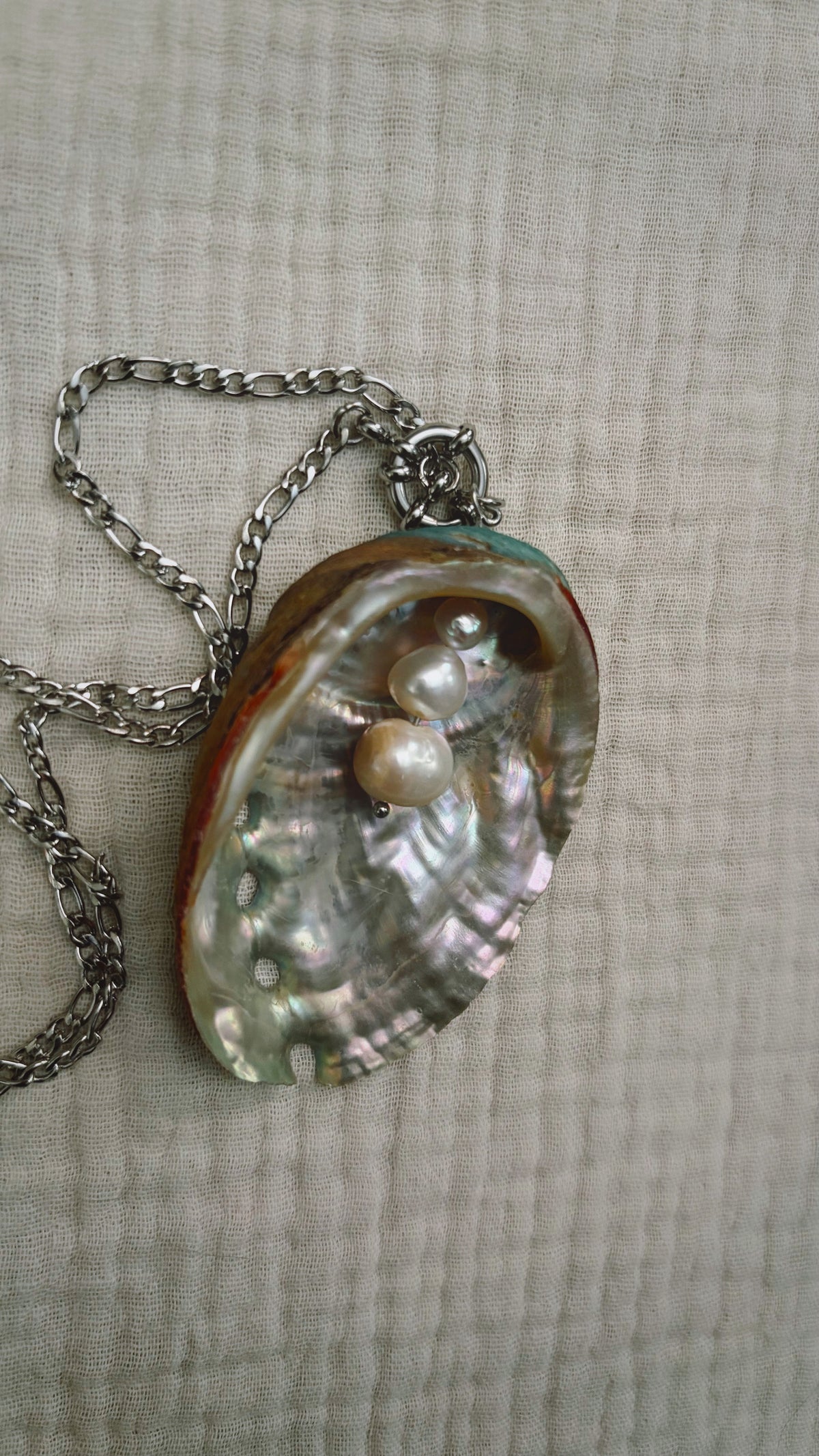 Iridescent abalone shell necklace with pearls and metal fringe