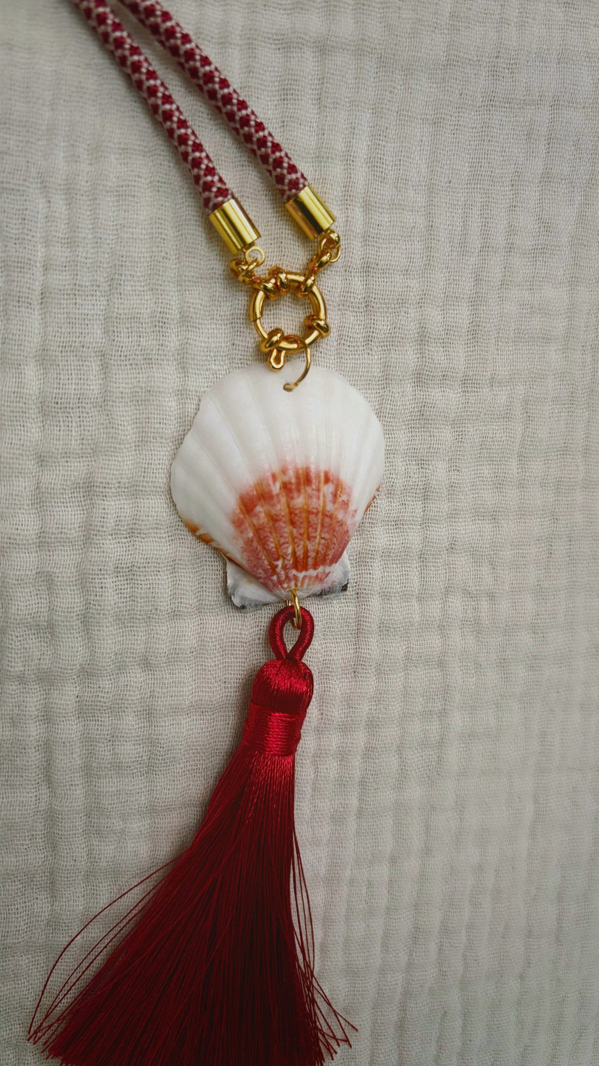 Cream scallop with mustard tassel on burgundy cord